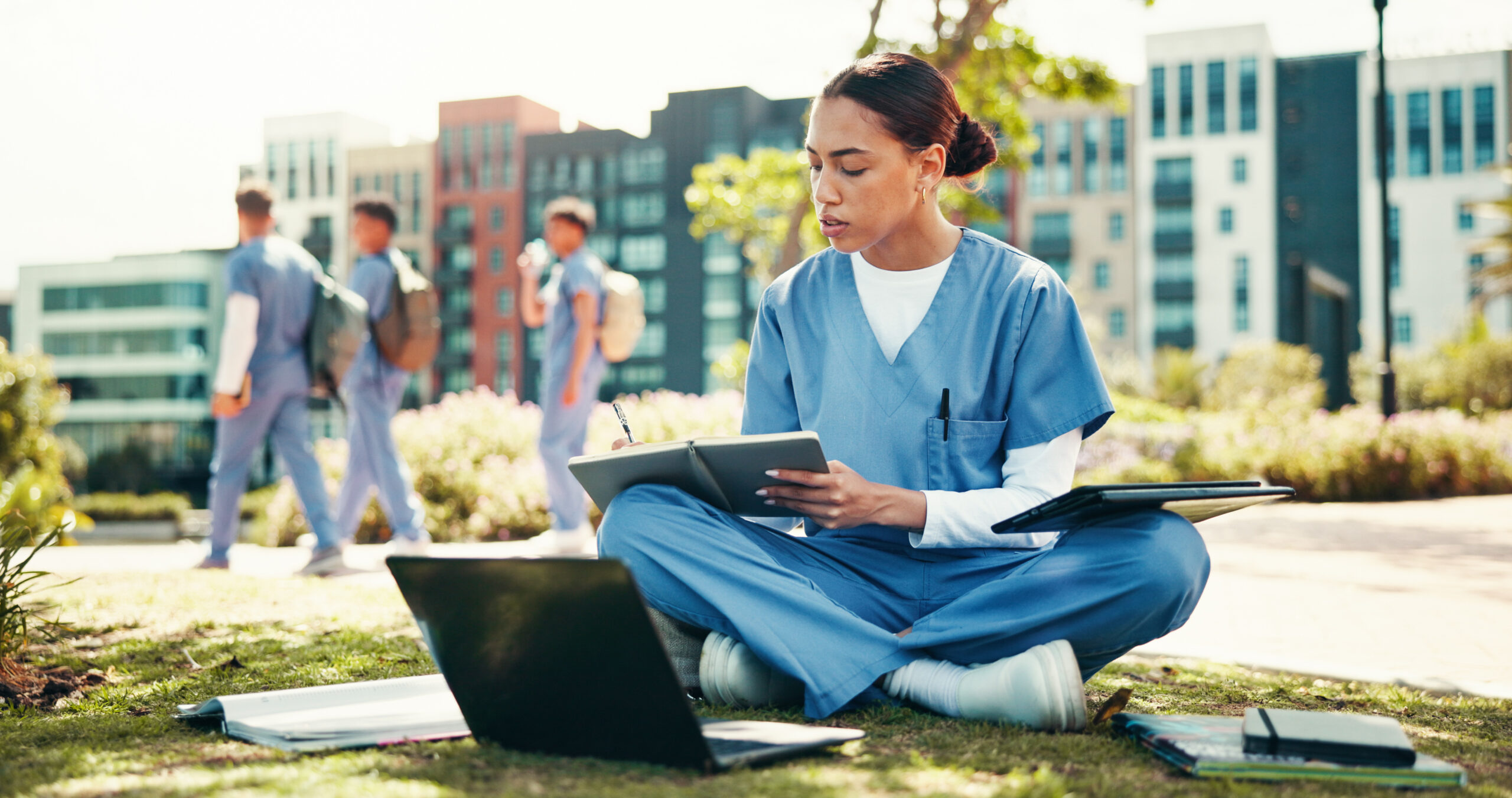 dentist student writing with book for internship, studying or research at med school. Female person, healthcare candidate or intern taking notes with laptop for medical exam or test at campus